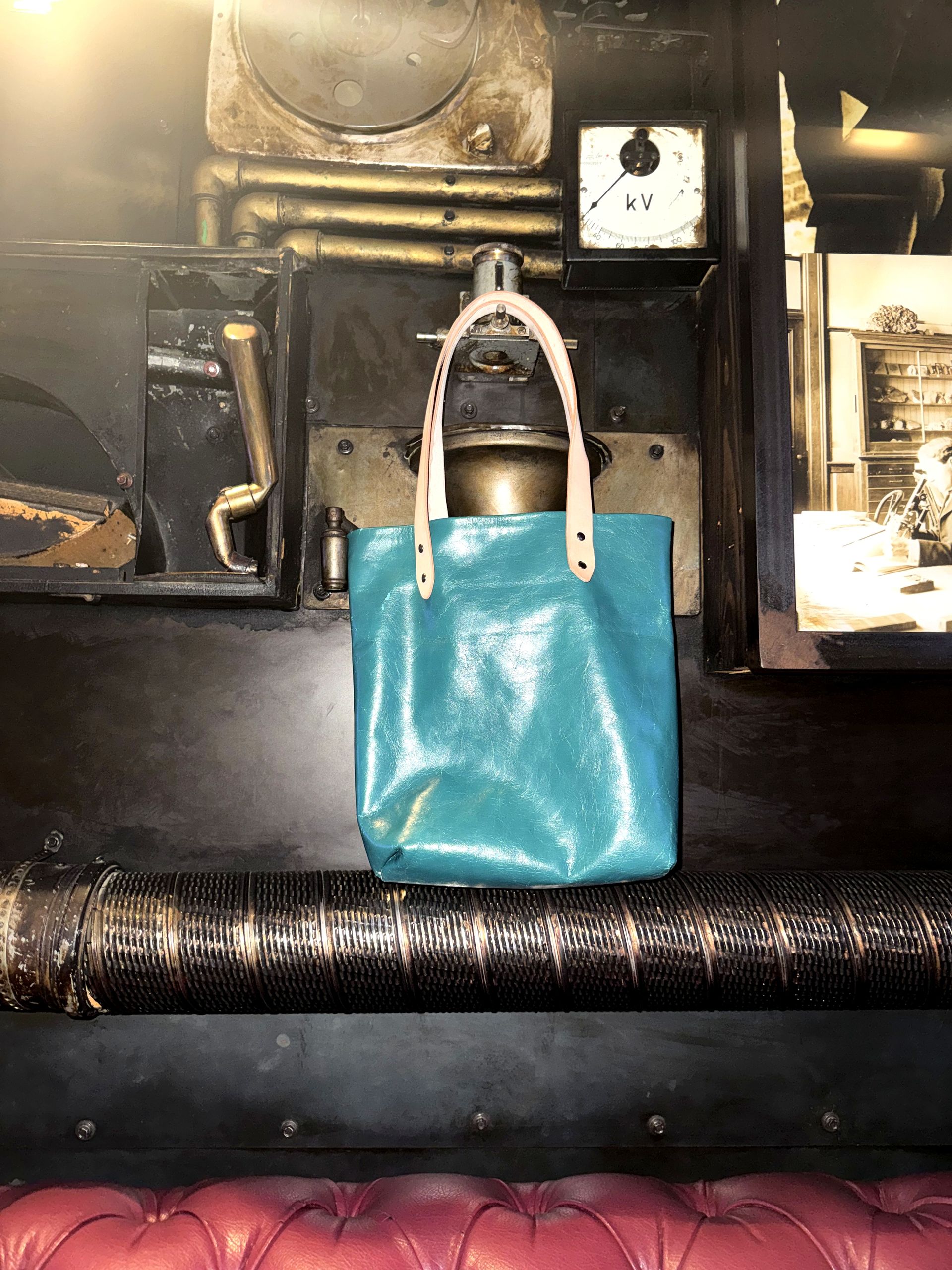 Handmade leather tote hanging in the Filajdić Leather workshop